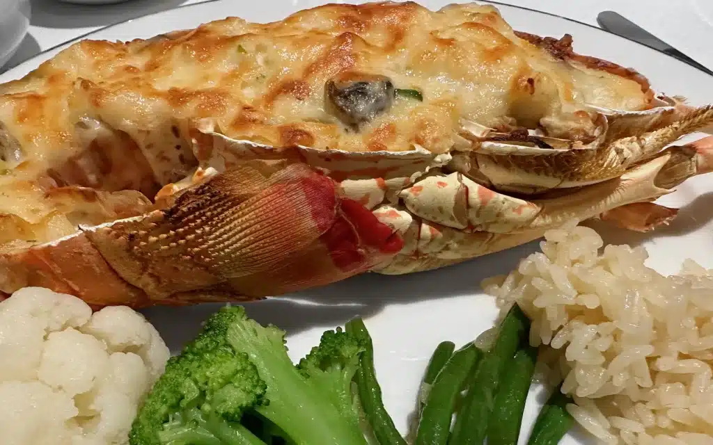 Lobster Thermidor with Mushrooms, Parmesan, Mustarded Cream & Pilaf Rice.